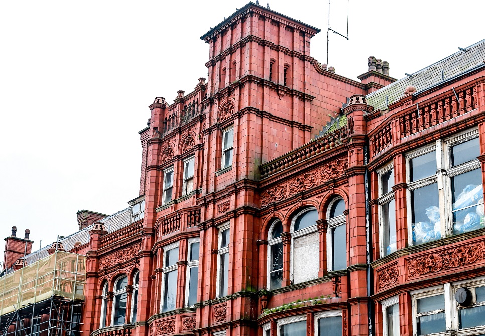 An elegant red old brick building  in an old town