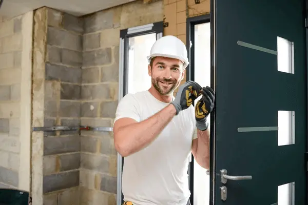 handsome-young-man-installing-door-600nw-1106108795