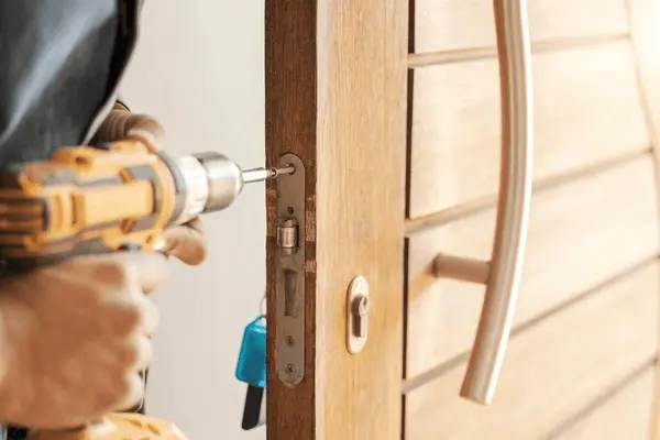 locksmith-hands-maintenance-handyman-drill-600nw-2272233055